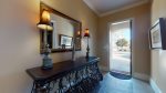 Warm and Inviting Foyer from Large Parking Pad, Leads Into Main Living Area and Theater Room